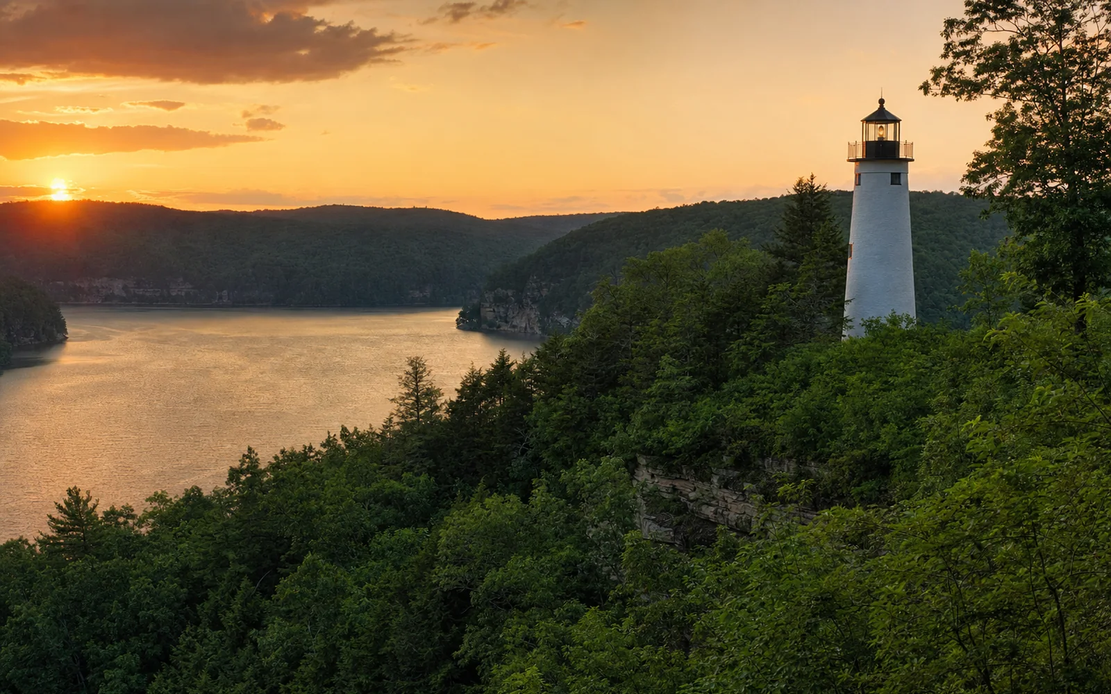 A tall white lighthouse tower with a dark top on a wooded hill above Summersville Lake at sunset, AI-generated illustration